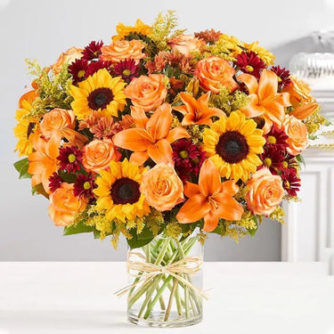 Grand Sunshine, Radiant Floral Arrangement, Sunflowers, Orange Roses, Orange Lilies, Red Chrysanthemums, Salal Tip, Solidaster, Cylinder Glass Vase